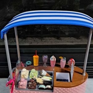 Blue and White Striped Toy Ice Cream Cart
